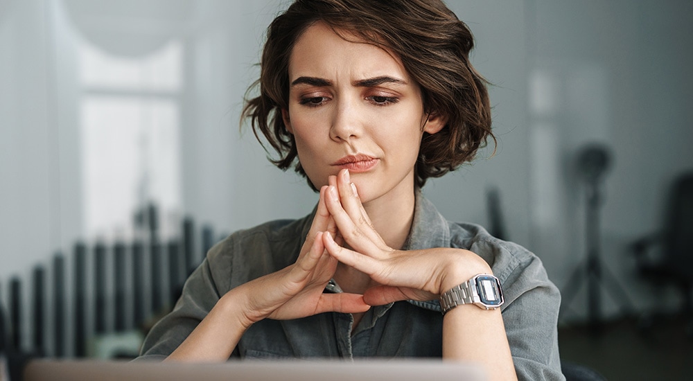 a woman contemplating a short term loan