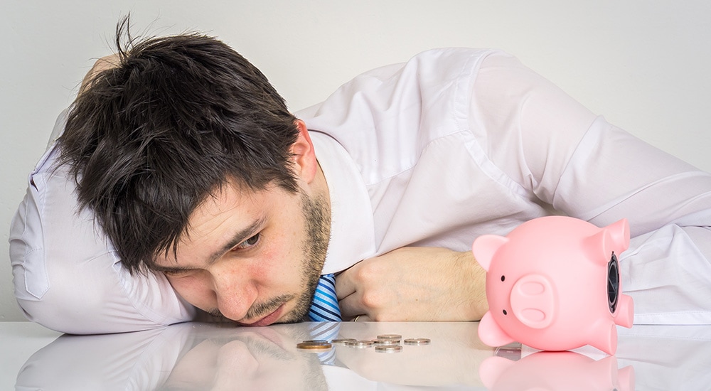 a man looking at his sad savings