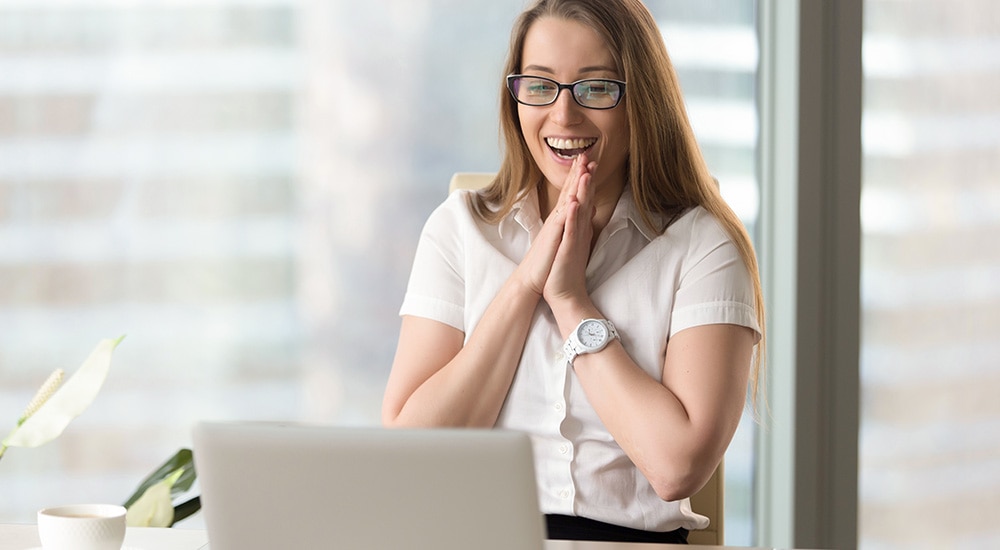 a woman excited she was approved for a loan
