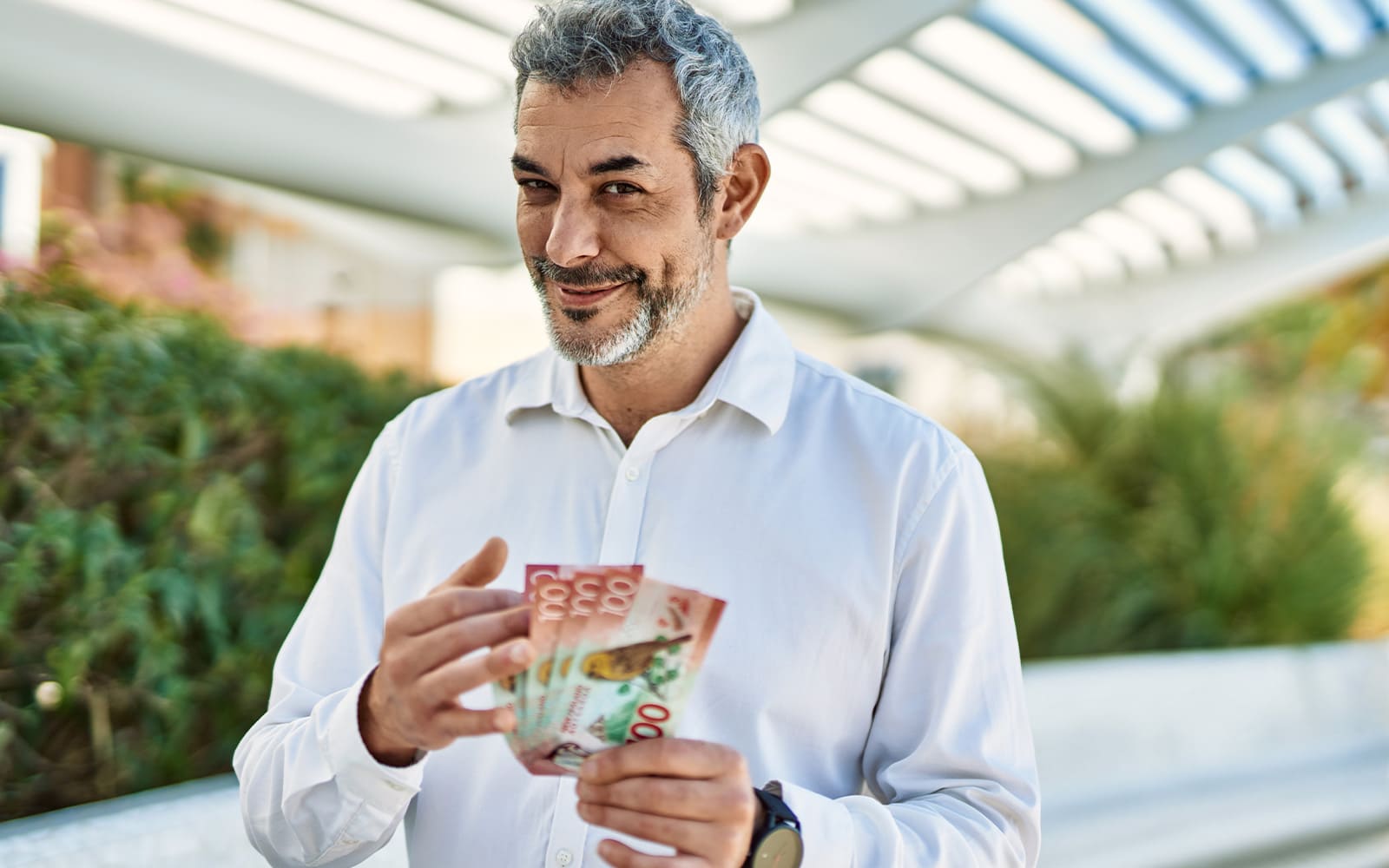 a man holding cash