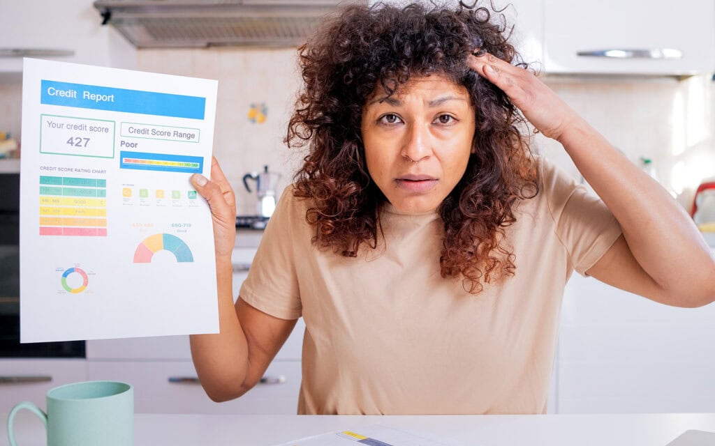 a woman stressed out about her poor credit score