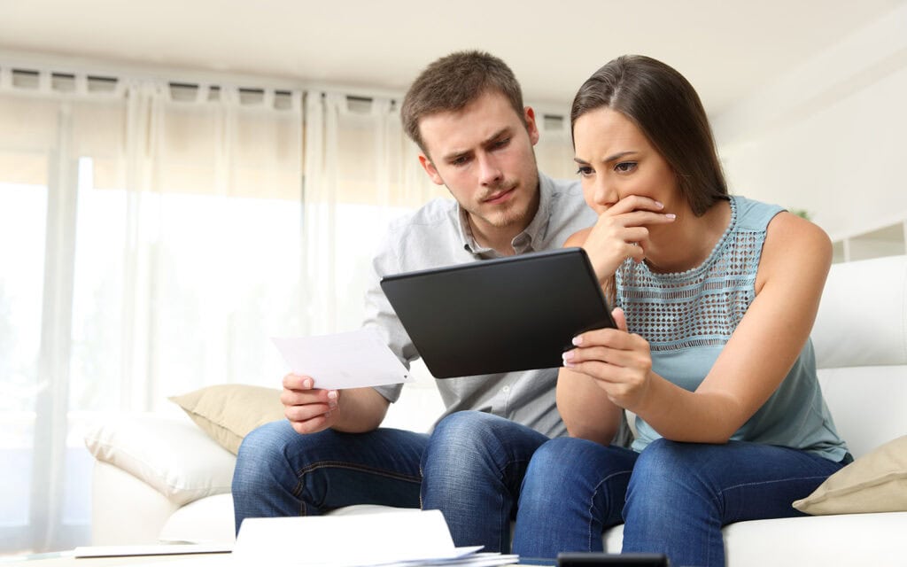 a couple reviewing their finances and credit score