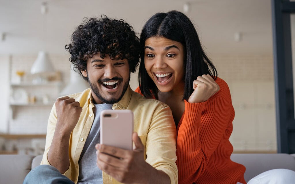 a couple excited they got approved for a loan with their bad credit