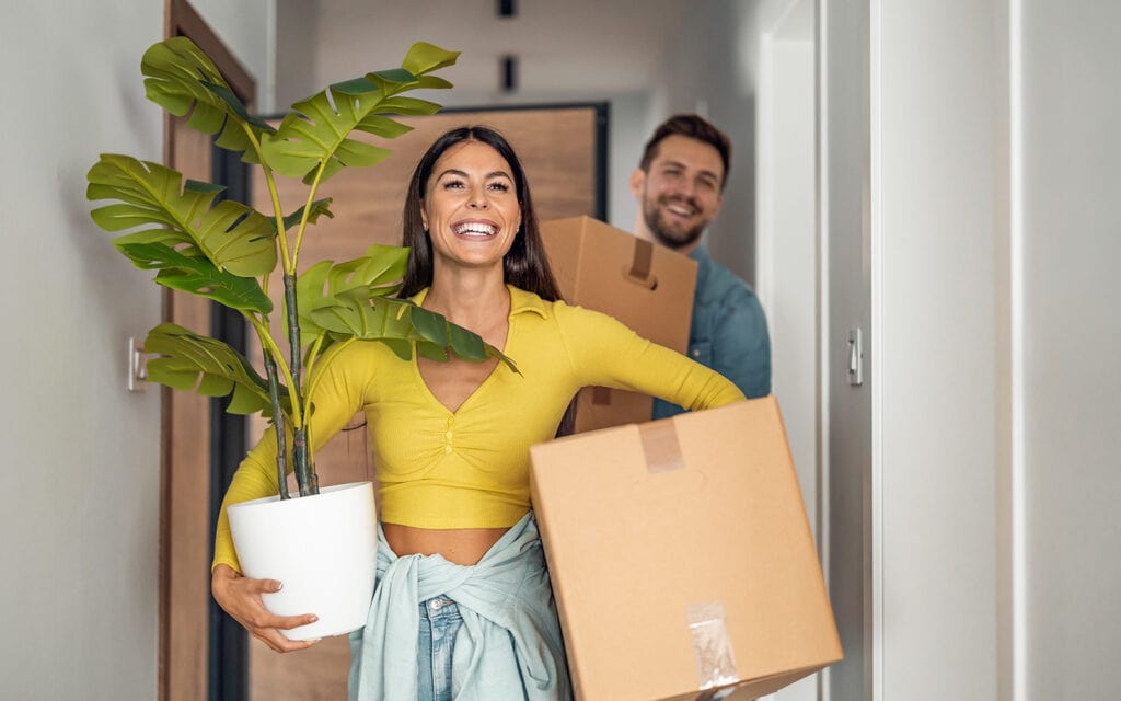 a couple moving into their new home