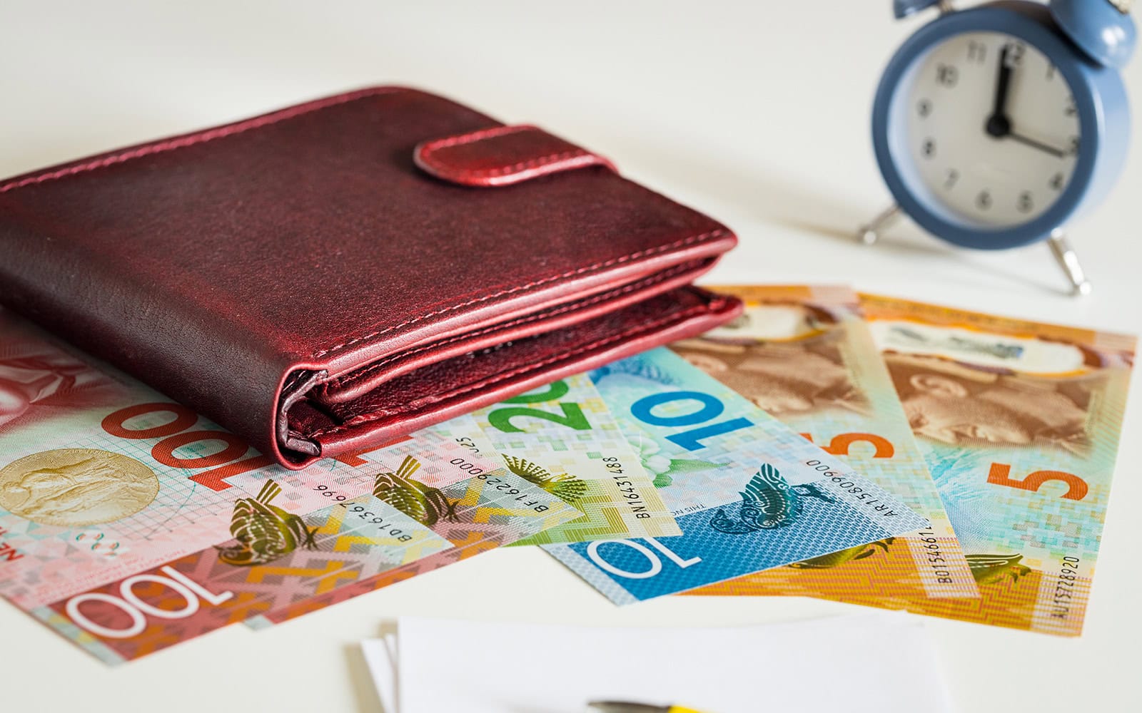 a leather wallet and cash