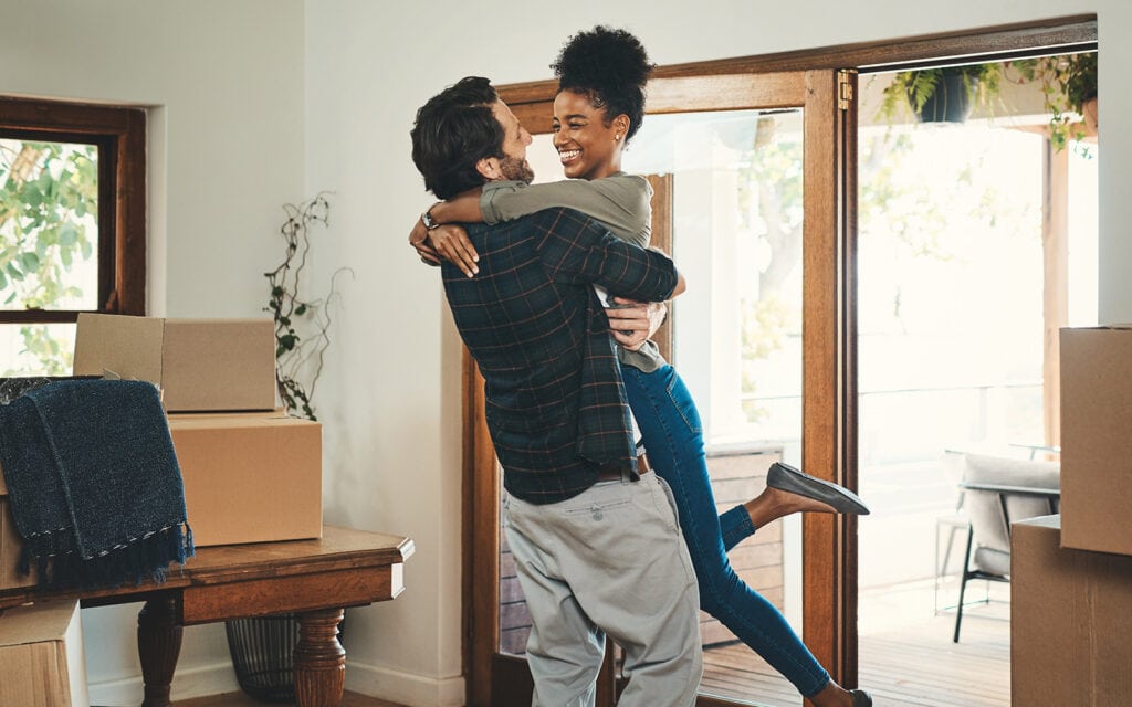 a happy couple hugging