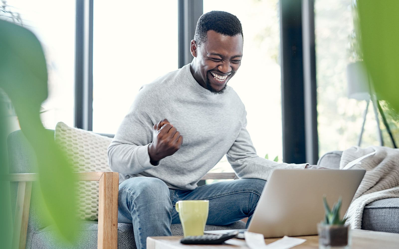 a man excited he got a debt consolidation loan