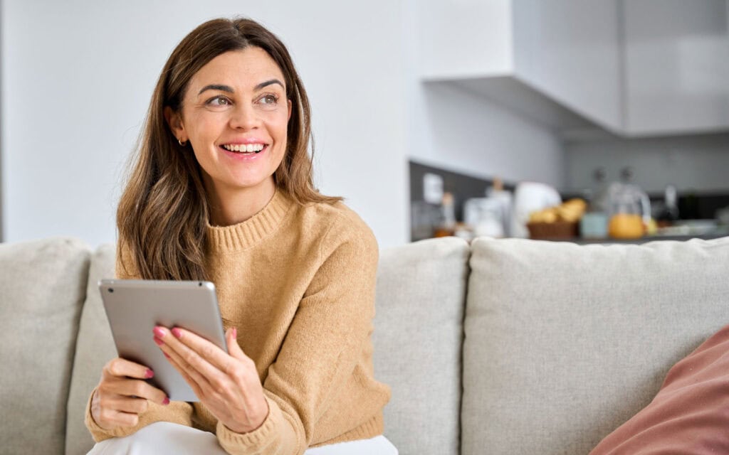 A woman happy to find the best debt consolidation option
