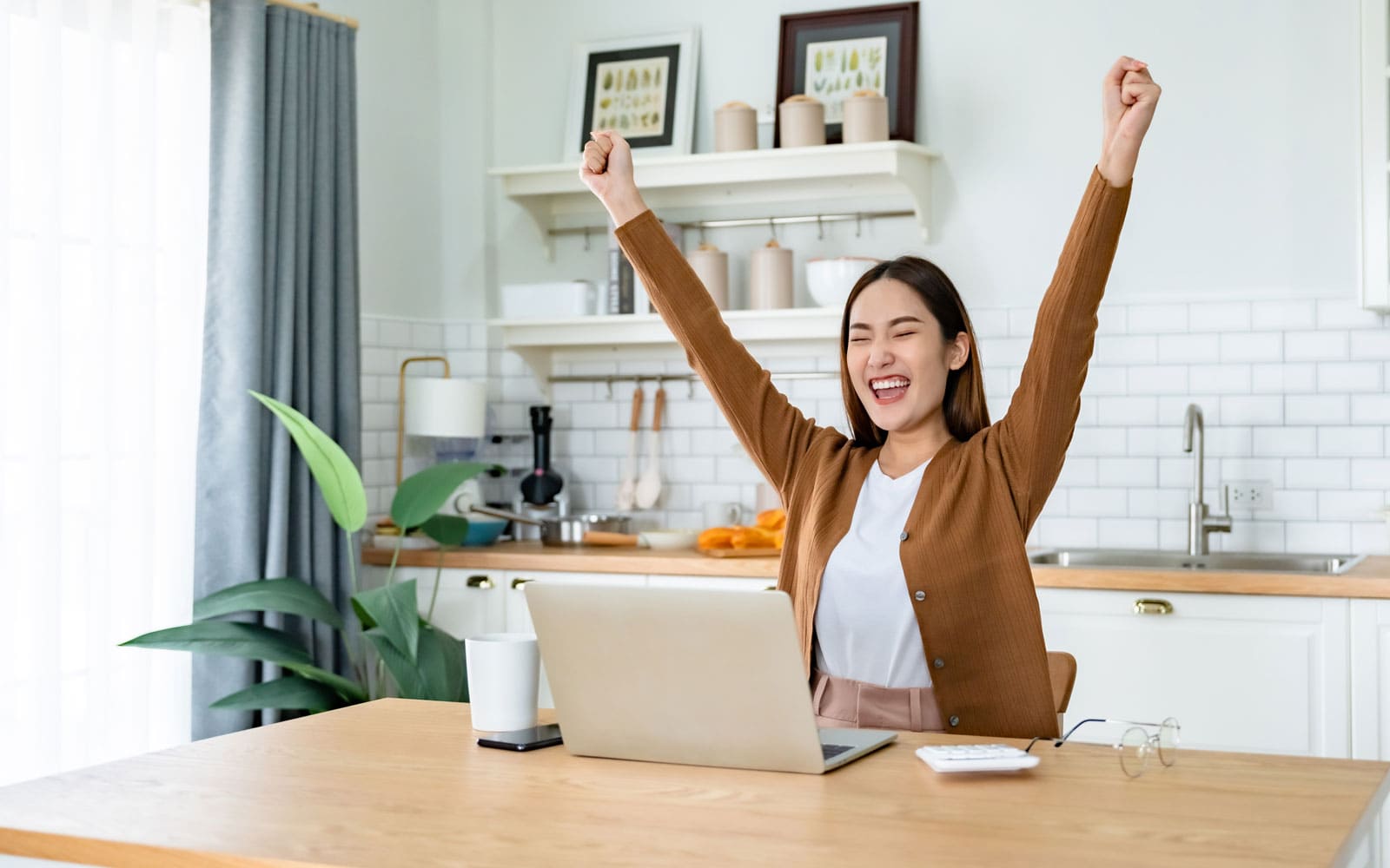 a woman excited she got an instant loan for her fair credit