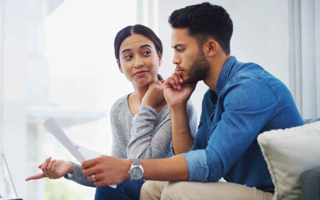 A couple viewing their credit scores