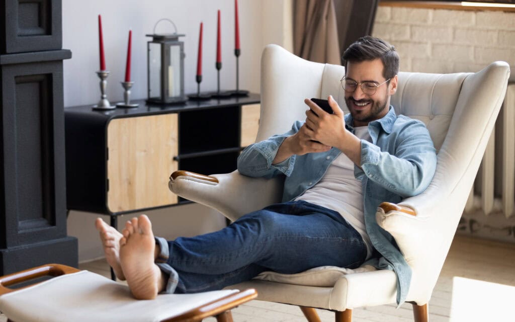 a guy looking at person loan options on his phone