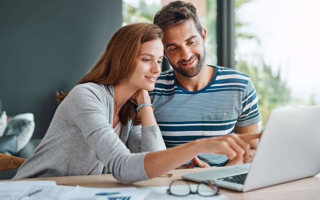 Couple looking at car finance options